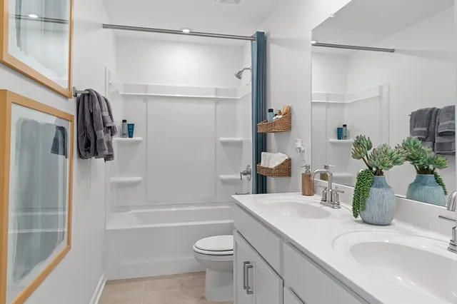 a bedroom with bed and a window