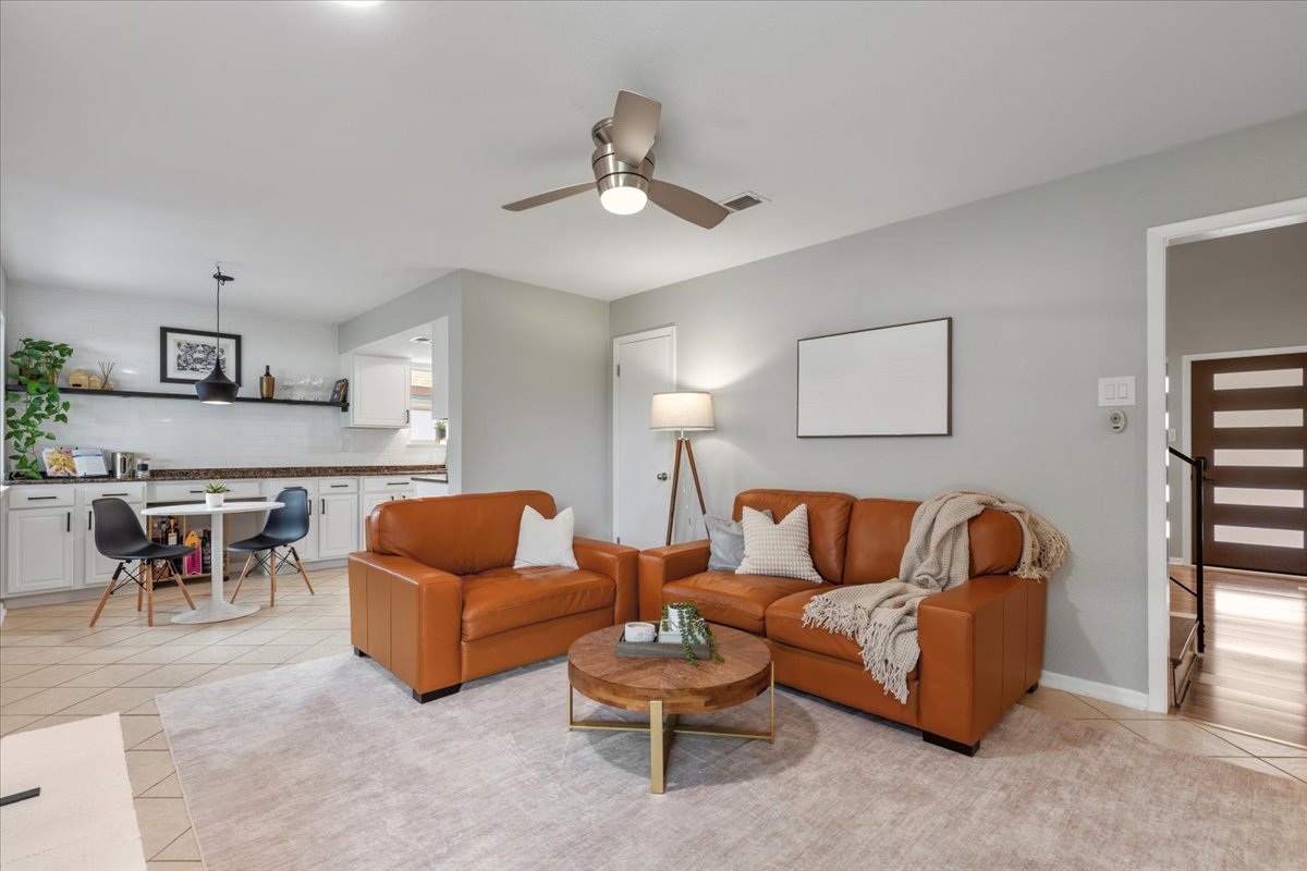 208 Skyloop Drive Austin, TX 78745 - Photo 10 of 34 Functional layout connecting living, dining, and kitchen spaces for easy everyday living.