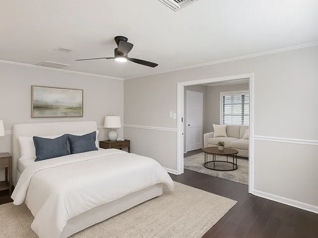 a bedroom with a bed and a couch