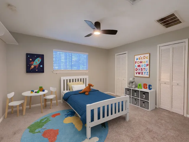 a bedroom with furniture and a window