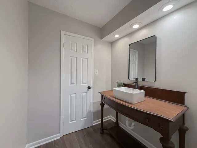 a bathroom with a sink and a mirror