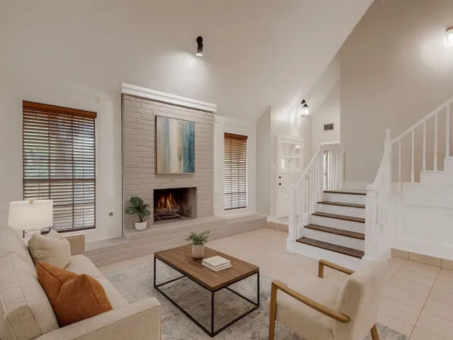 a living room with furniture and a fireplace