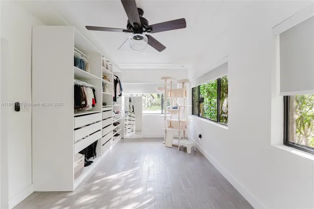 a view of a livingroom with furniture and a window