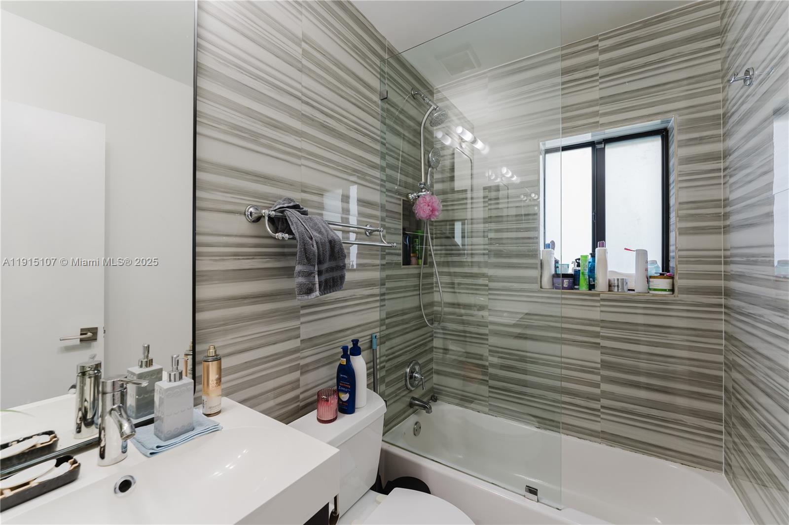 511 Northeast 134th Street North Miami, FL 33161 - Photo 19 of 40 a bathroom with a sink a toilet and shower