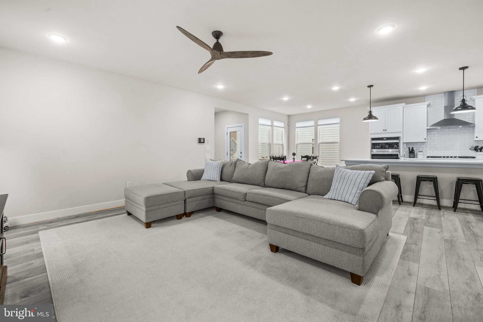 1814 River Heritage Boulevard Dumfries, VA 22026 - Photo 12 of 55 a living room with furniture and a ceiling fan