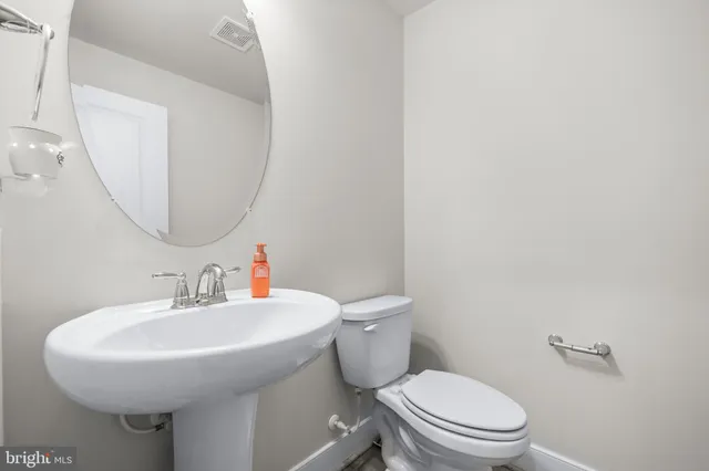 a spacious bedroom with a bed and a window