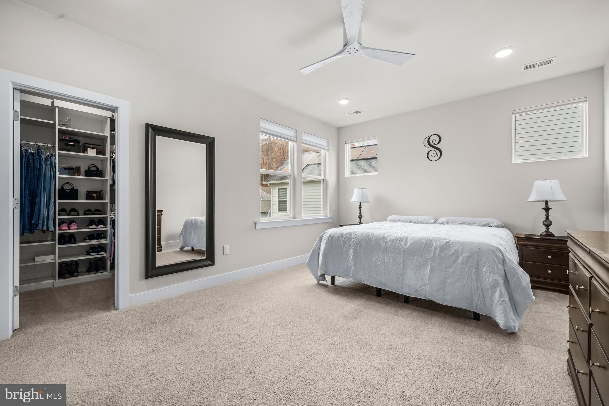 1814 River Heritage Boulevard Dumfries, VA 22026 - Photo 18 of 55 a spacious bedroom with a bed and a window