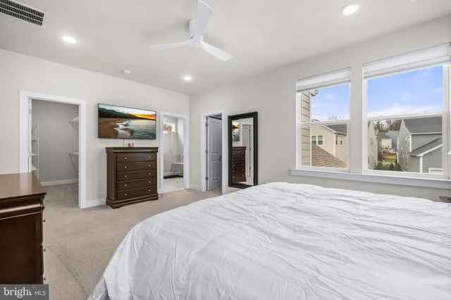 a bathroom with a double vanity sink mirror and shower