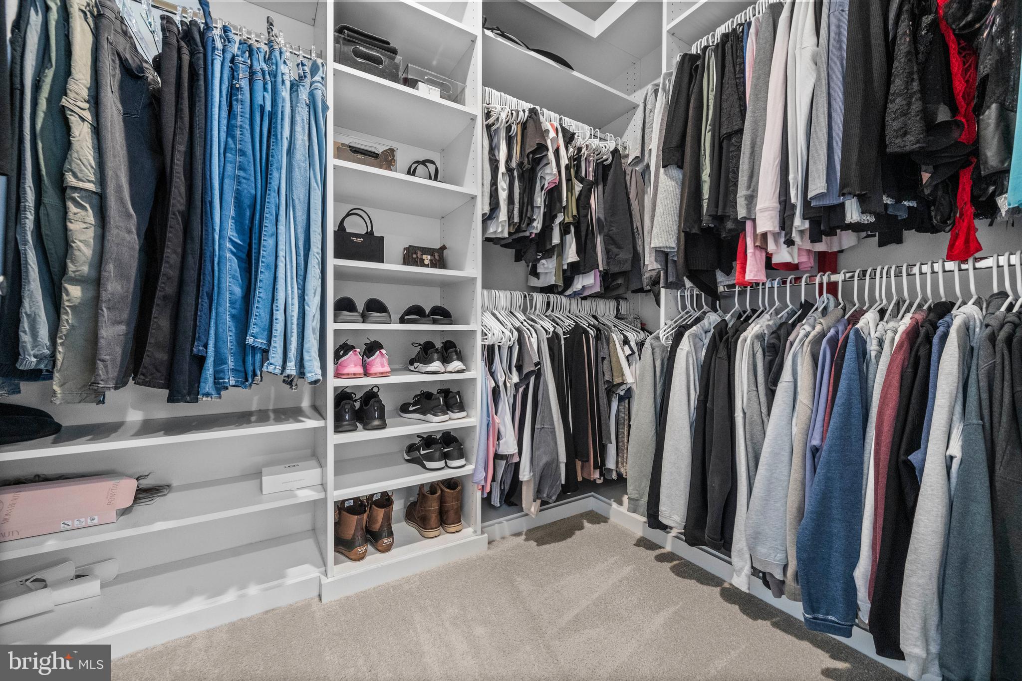 1814 River Heritage Boulevard Dumfries, VA 22026 - Photo 20 of 55 a view of walk in closet with clothes and shoes