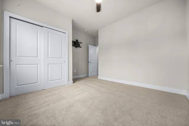 a view of an empty room and entryway