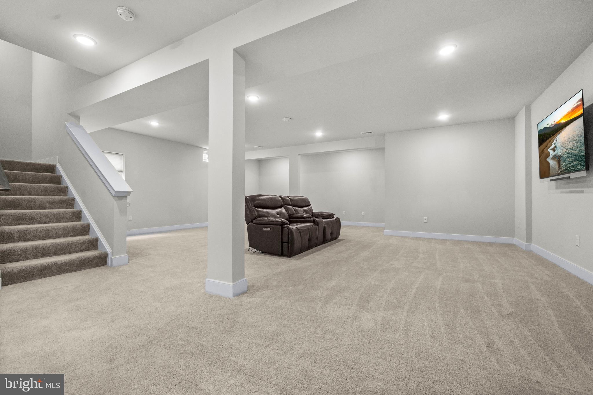 1814 River Heritage Boulevard Dumfries, VA 22026 - Photo 32 of 55 a view of hallway with a couch and a flat screen tv
