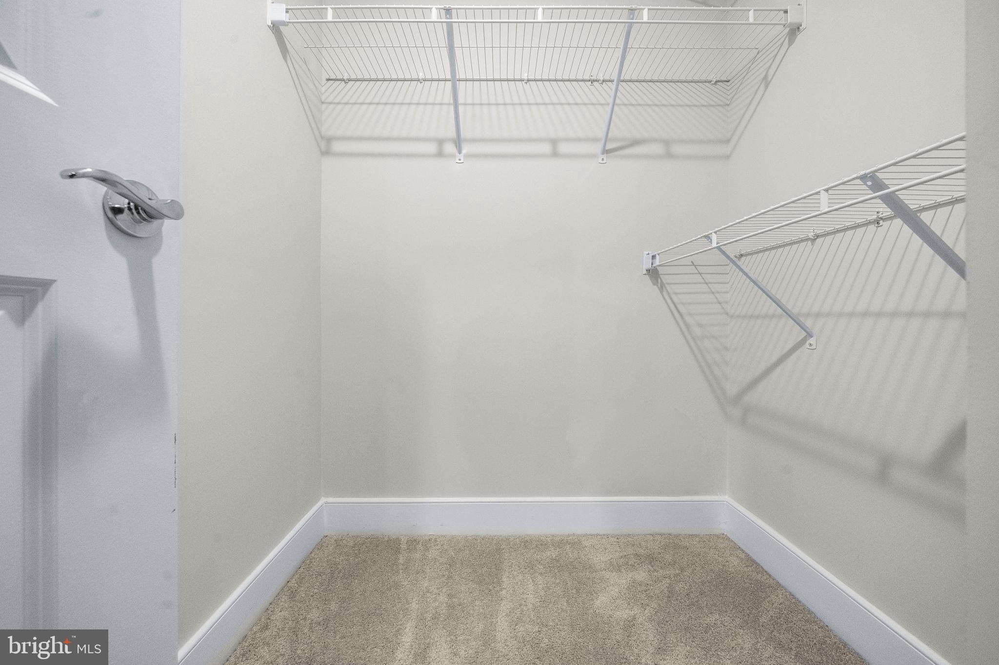 1814 River Heritage Boulevard Dumfries, VA 22026 - Photo 36 of 55 a view of a room with racks on the wall