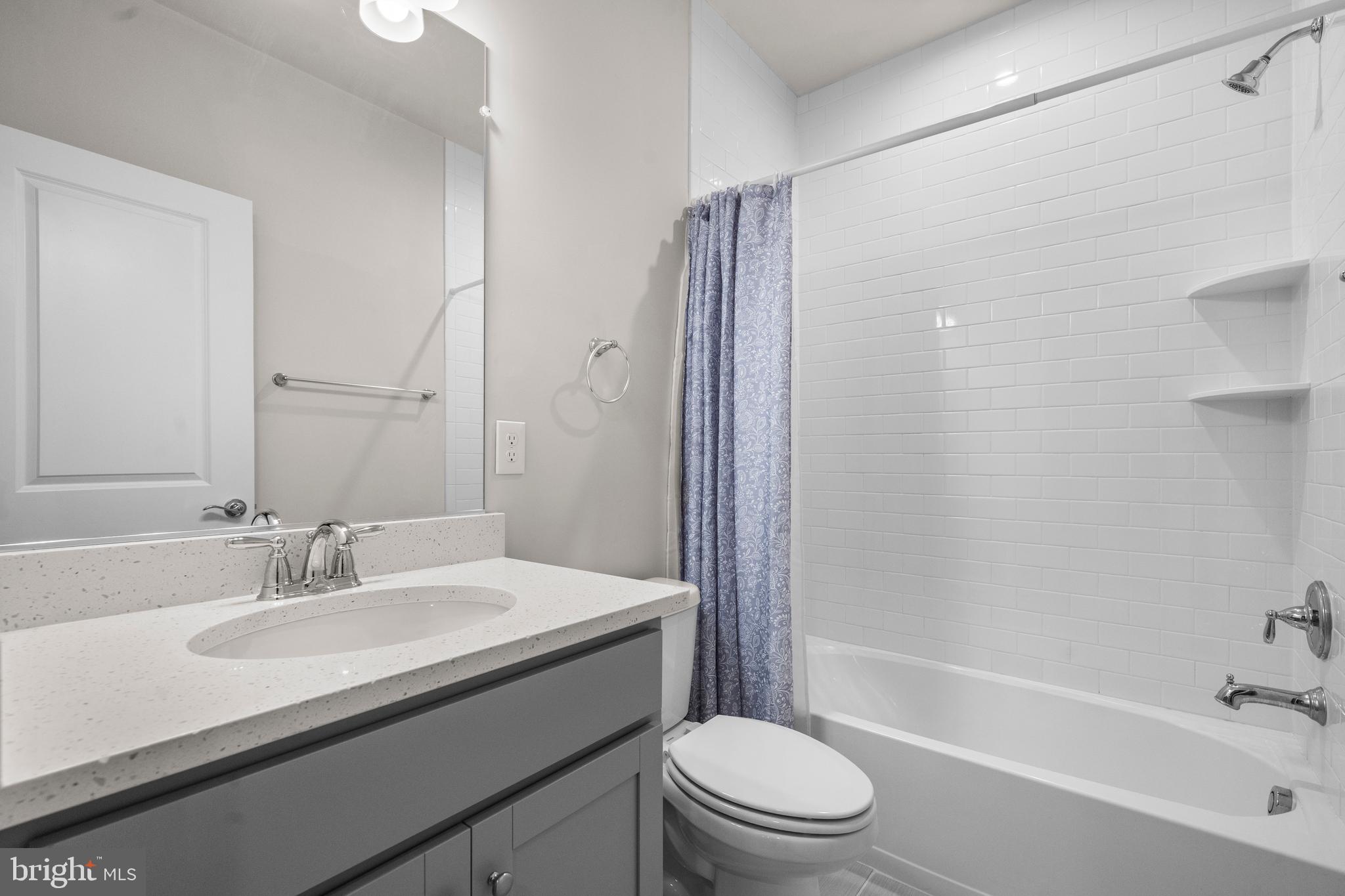1814 River Heritage Boulevard Dumfries, VA 22026 - Photo 37 of 55 a bathroom with a sink a toilet and shower