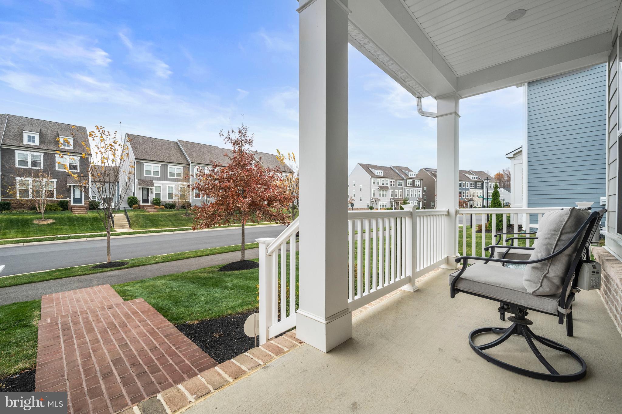 1814 River Heritage Boulevard Dumfries, VA 22026 - Photo 40 of 55 a view of a chair and table in the patio with a yard