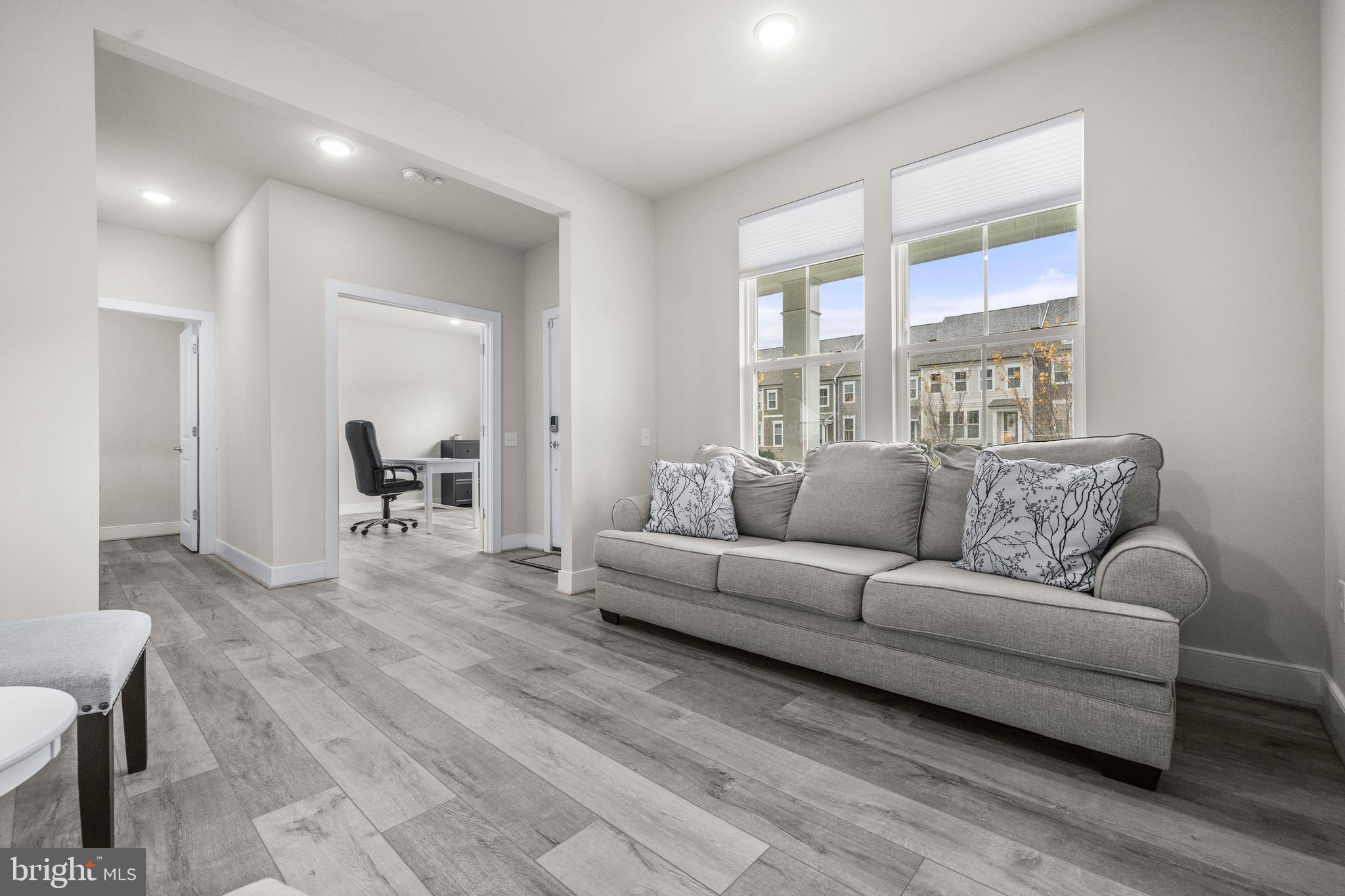 1814 River Heritage Boulevard Dumfries, VA 22026 - Photo 4 of 55 a living room with furniture and a large window