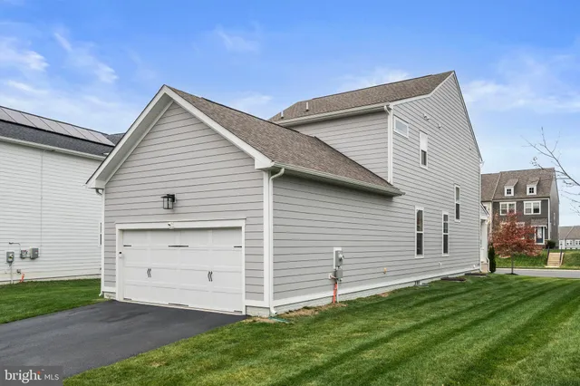 a front view of a house with yard