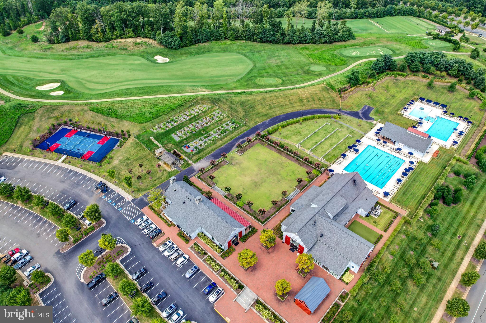 1814 River Heritage Boulevard Dumfries, VA 22026 - Photo 46 of 55 an aerial view of a tennis ground and a cars park side of the road
