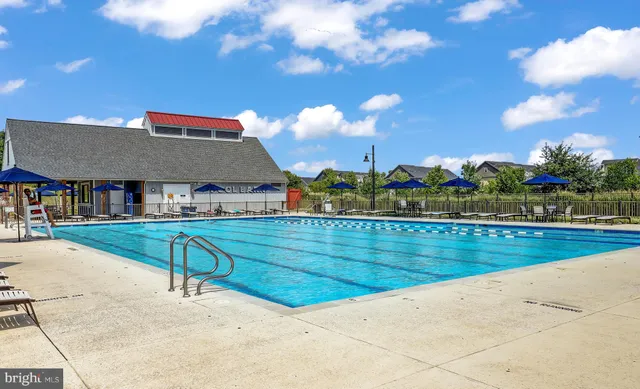 a view of a patio with table and chairs and a yard