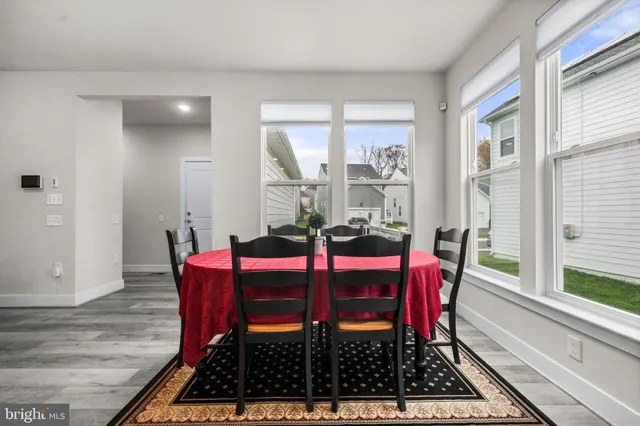 a living room with furniture and a ceiling fan