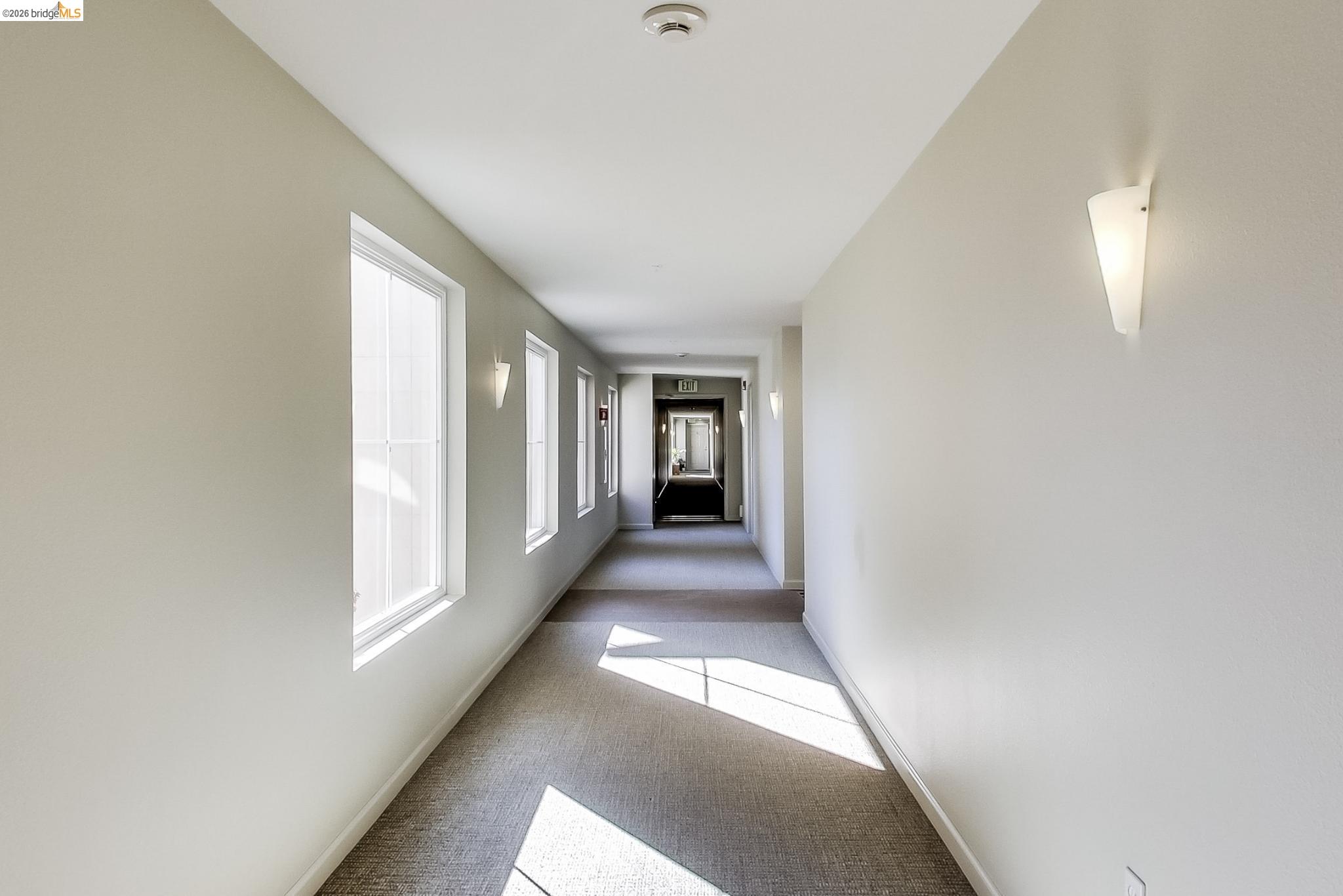 555 10th Street, Unit 312 Oakland, CA 94607 - Photo 23 of 34 a view of hallway with windows