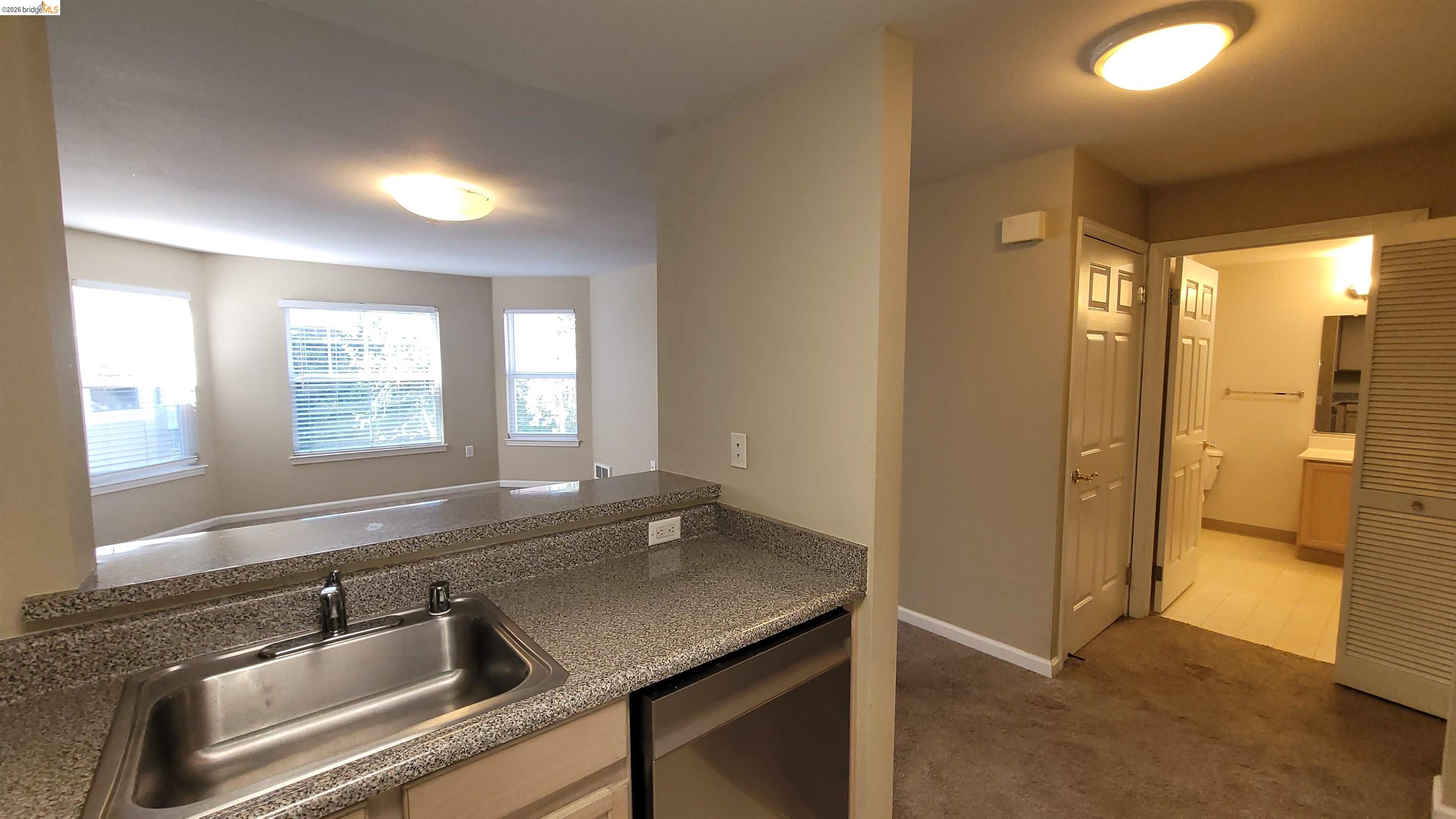 555 10th Street, Unit 312 Oakland, CA 94607 - Photo 6 of 34 a bathroom with a sink and a mirror