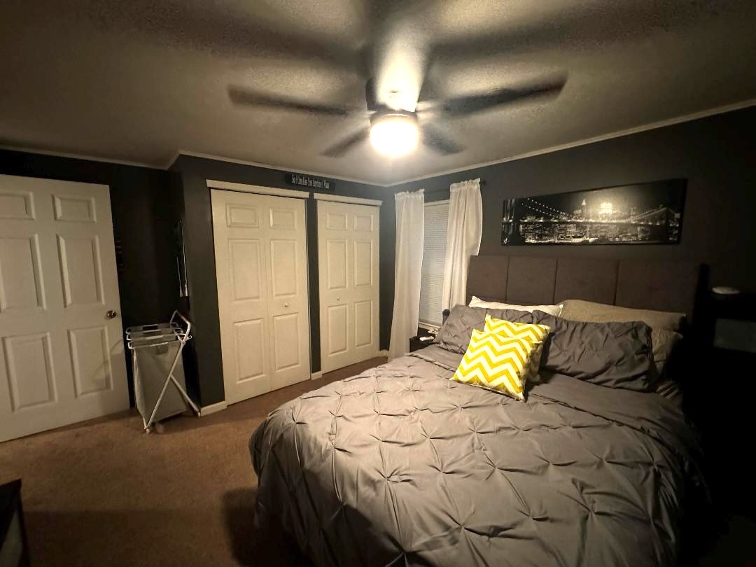 11 Cross Street Bristol, IL 60512 - Photo 7 of 11 a bedroom with a bed and a chandelier