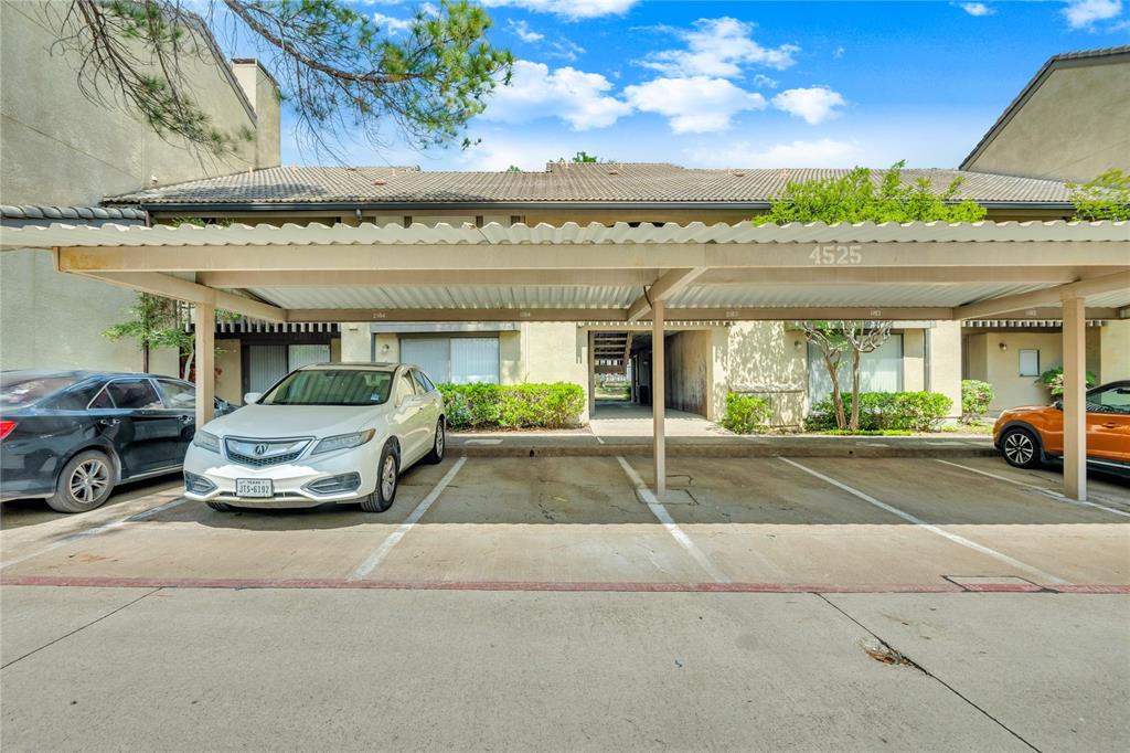 This property features covered parking spaces within a well-maintained complex, offering convenient access to residences