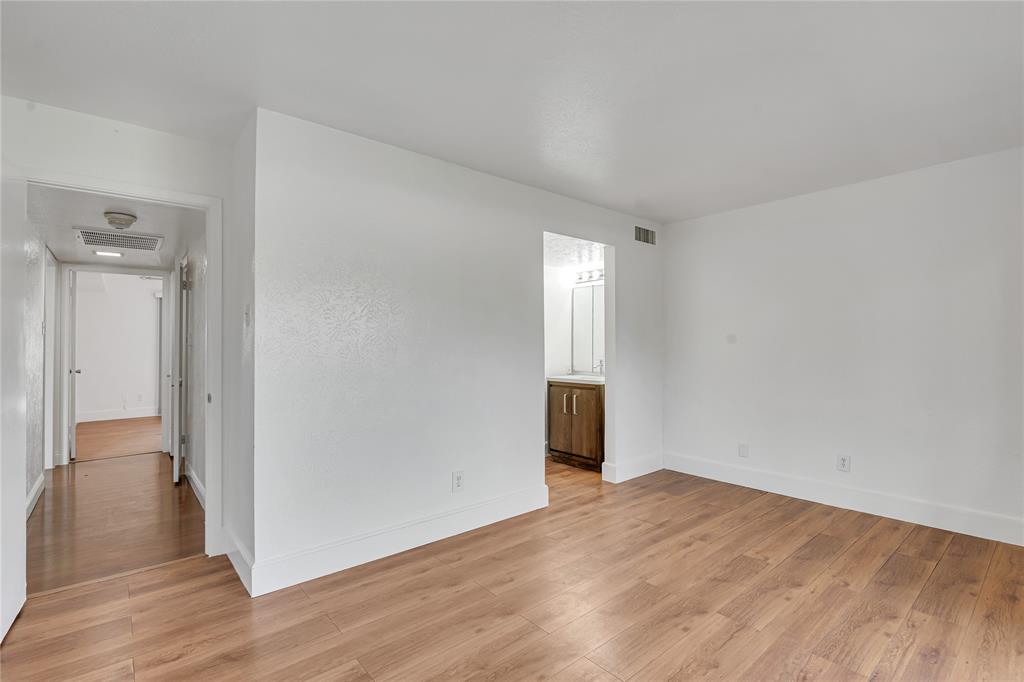 4525 North O'Connor Road, Unit 1184 Irving, TX 75062 - Photo 14 of 20 This interior space features light wood-style flooring and white walls