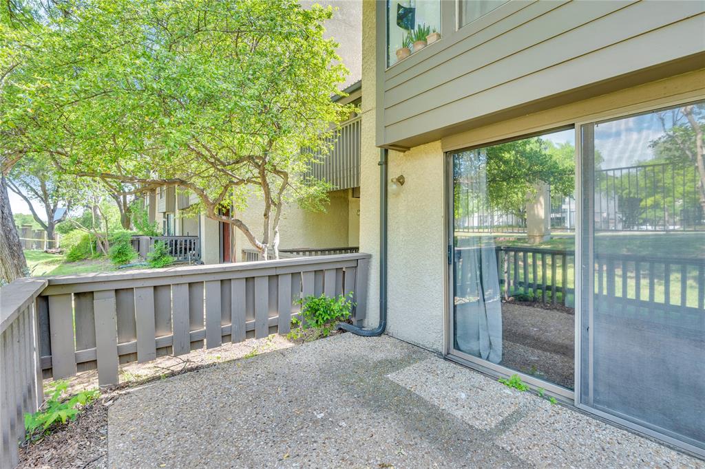 4525 North O'Connor Road, Unit 1184 Irving, TX 75062 - Photo 19 of 20 The property features a private patio area with a concrete surface, enclosed by a fence