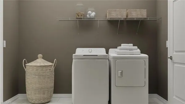 a utility room with dryer and washer