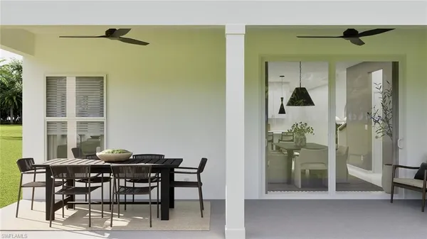 a view of a dining room with furniture and a window