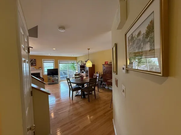 a view of a dining room with furniture window and wooden floor