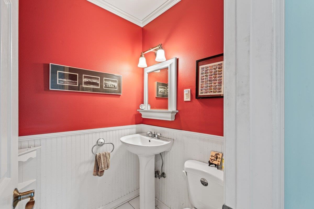 353 Colonial Road Memphis, TN 38117 - Photo 13 of 37 Half bathroom with crown molding and wainscoting