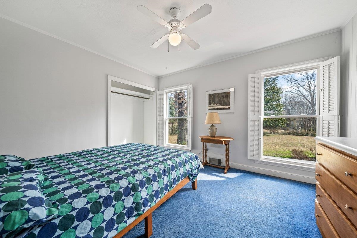 353 Colonial Road Memphis, TN 38117 - Photo 20 of 37 Bedroom with dark colored carpet, crown molding, and a ceiling fan