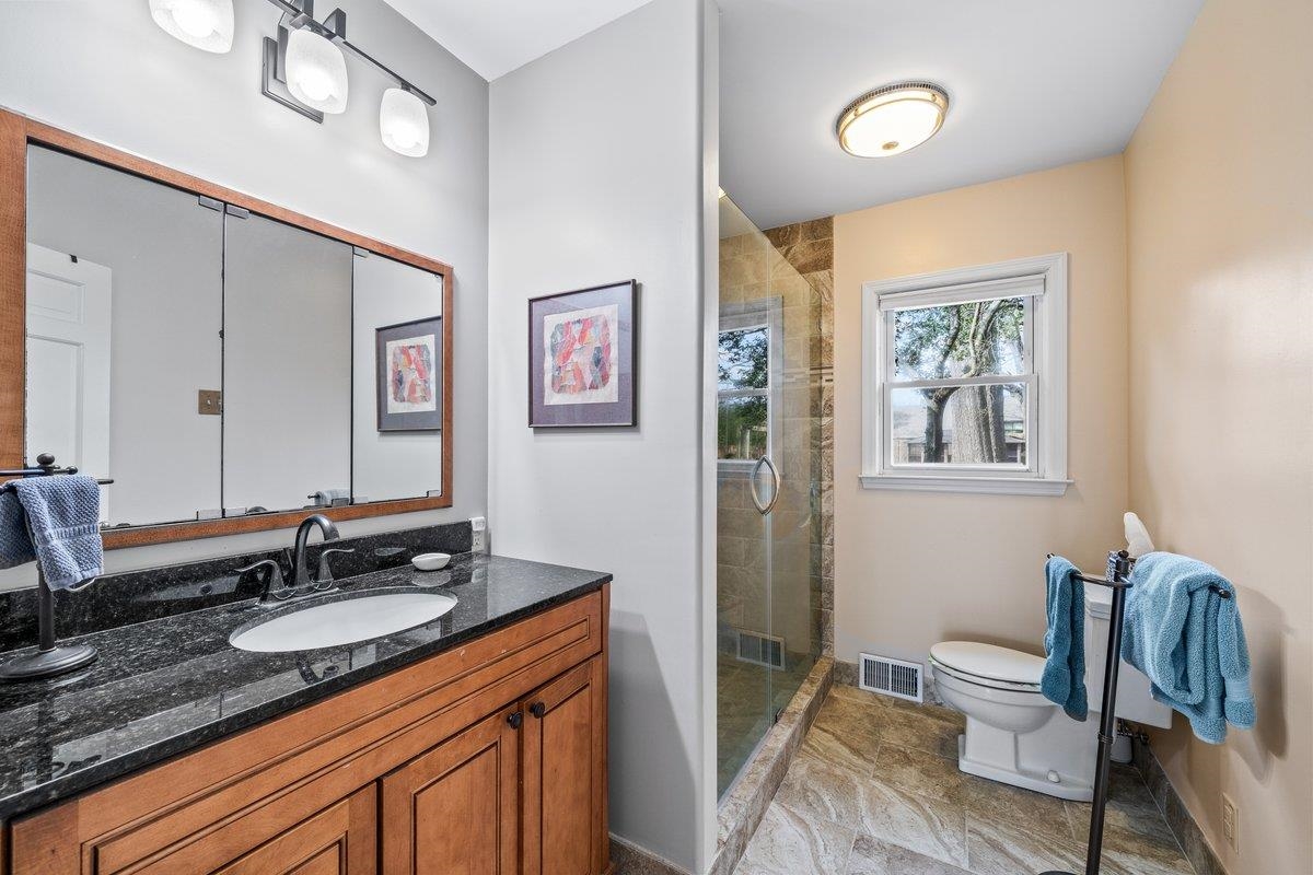 353 Colonial Road Memphis, TN 38117 - Photo 22 of 37 Full bathroom with vanity and a stall shower