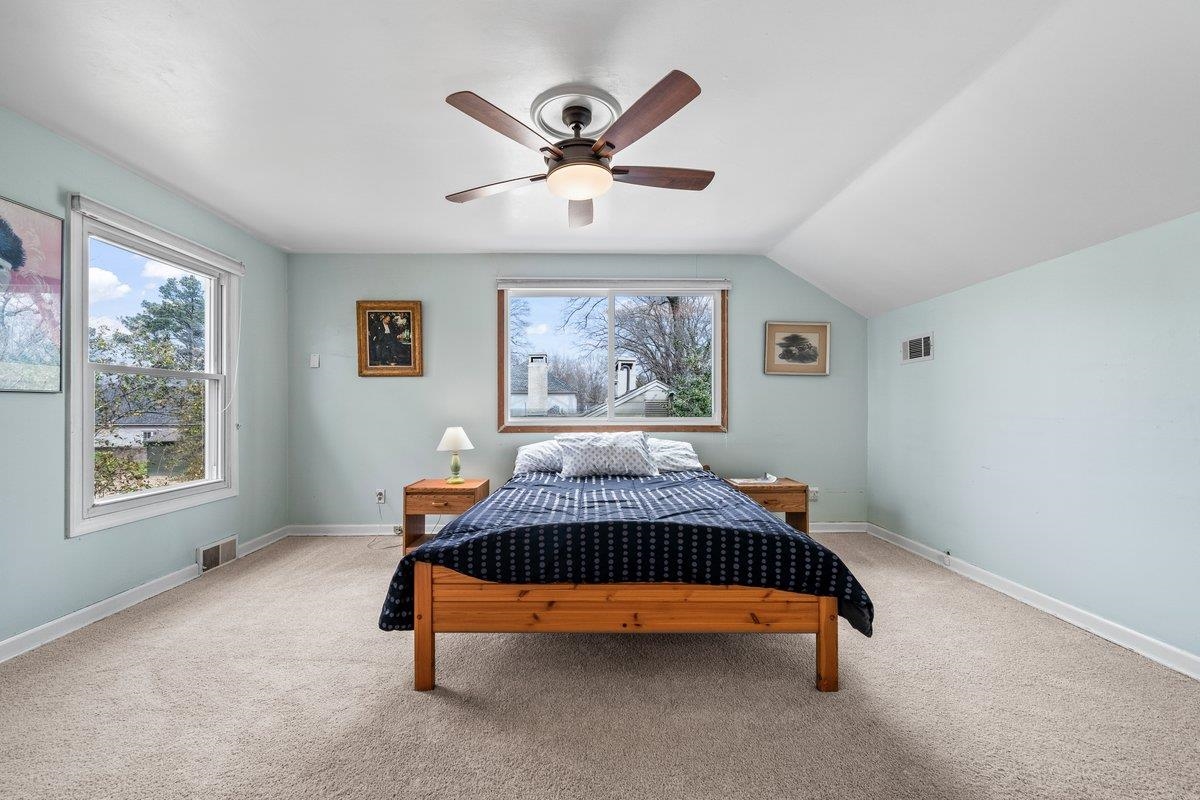 353 Colonial Road Memphis, TN 38117 - Photo 23 of 37 Bedroom with light colored carpet, a ceiling fan, and lofted ceiling