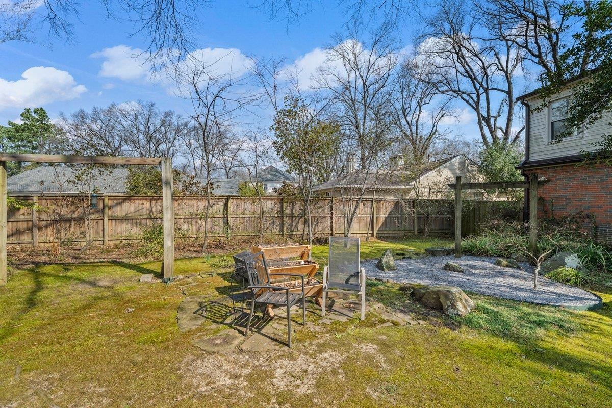 353 Colonial Road Memphis, TN 38117 - Photo 29 of 37 Fenced backyard with a patio