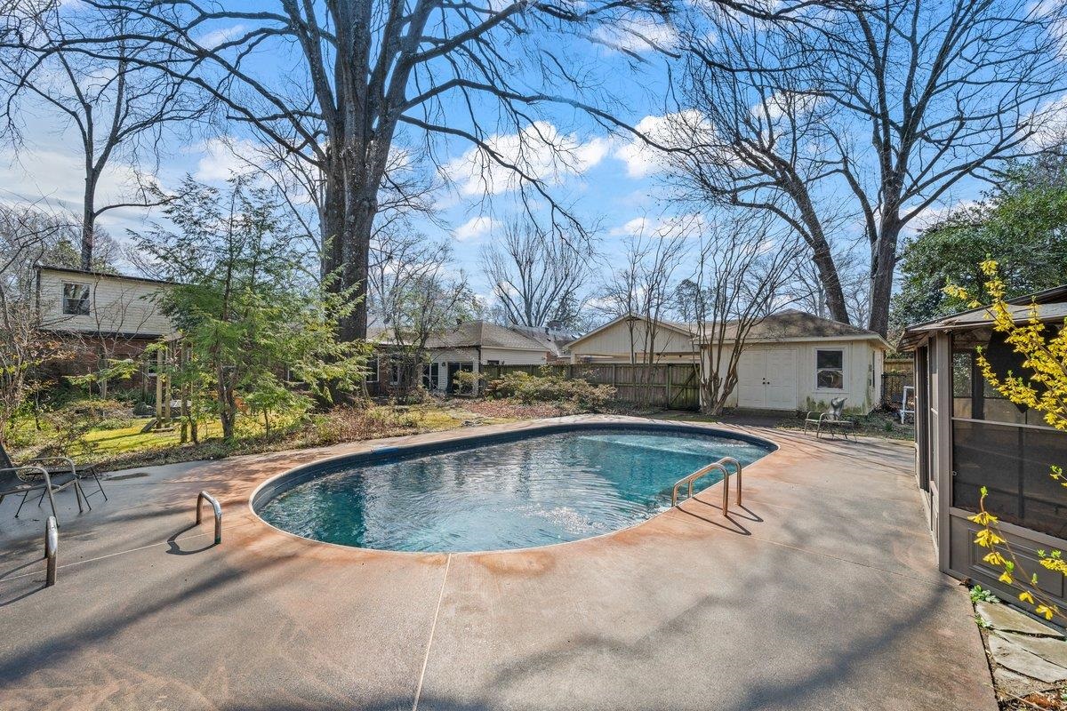 353 Colonial Road Memphis, TN 38117 - Photo 32 of 37 Swimming pool featuring a patio