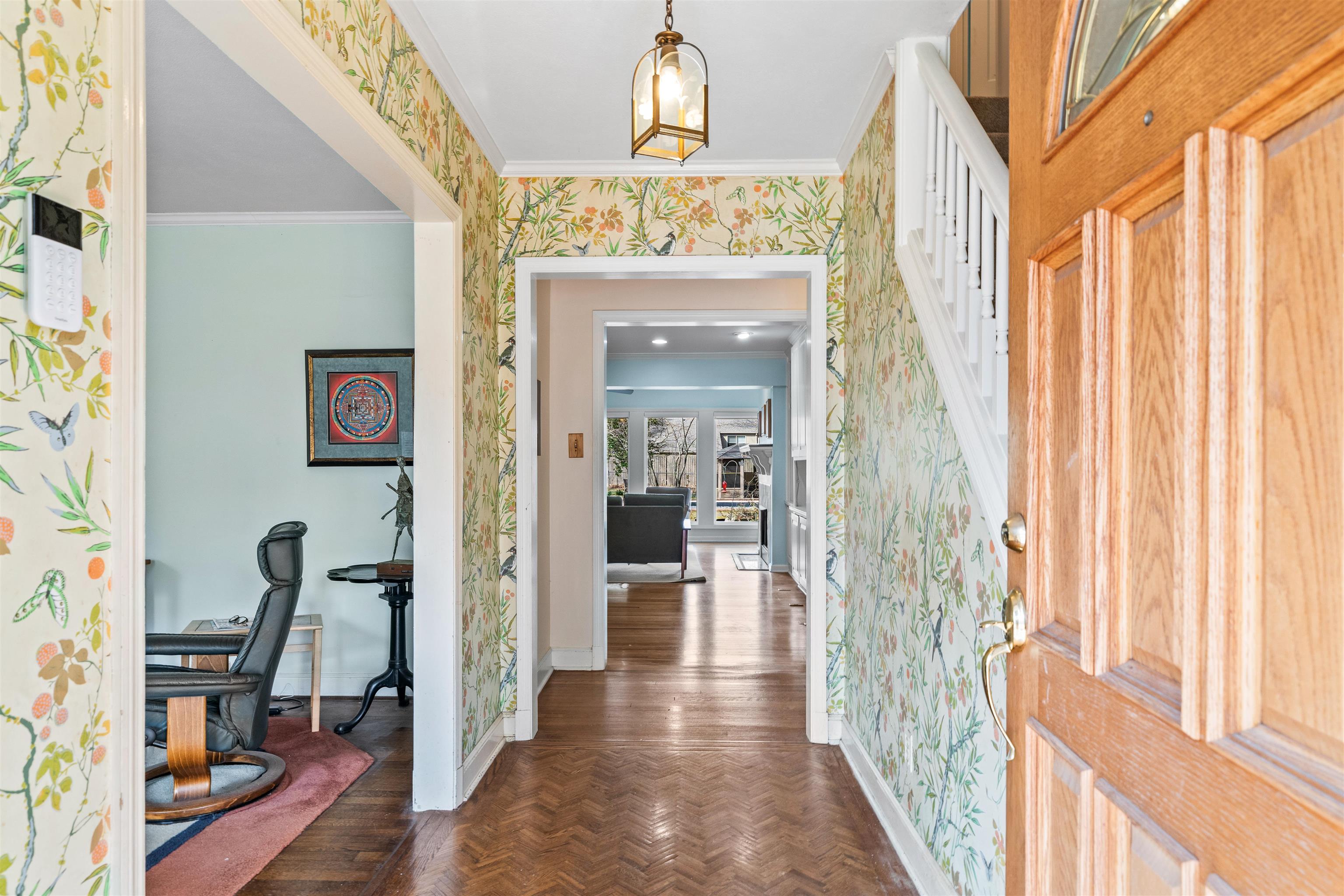 353 Colonial Road Memphis, TN 38117 - Photo 4 of 37 Foyer featuring parquet flooring, ornamental molding, and wallpapered walls