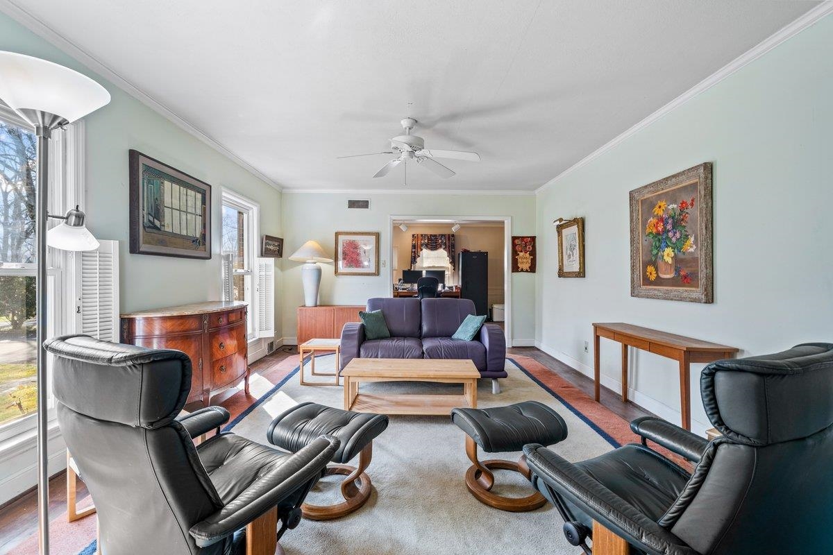 353 Colonial Road Memphis, TN 38117 - Photo 6 of 37 Living area with ornamental molding, a ceiling fan, and wood finished floors