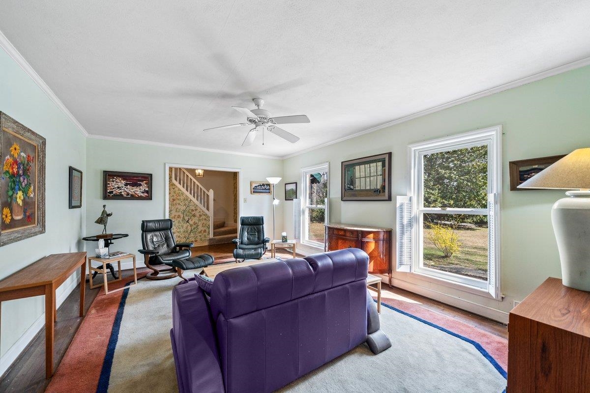 353 Colonial Road Memphis, TN 38117 - Photo 7 of 37 Living room with a ceiling fan and ornamental molding