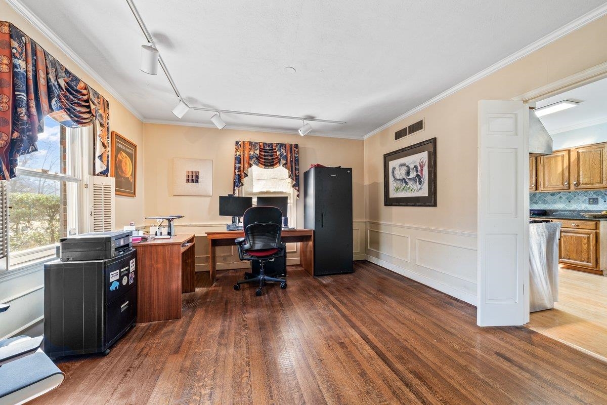 353 Colonial Road Memphis, TN 38117 - Photo 8 of 37 Office space featuring crown molding, dark wood-type flooring, wainscoting, rail lighting, and a decorative wall
