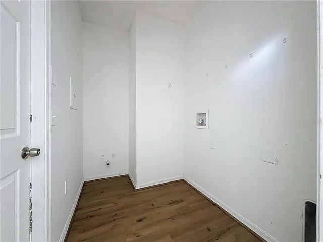 a view of a small space with wooden floor