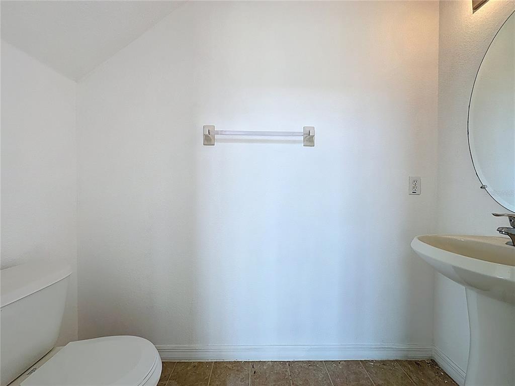 1430 Nelson Brook Way Kissimmee, FL 34759 - Photo 23 of 37 a bathroom with a toilet and a sink