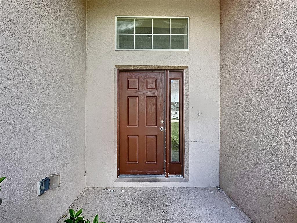 1430 Nelson Brook Way Kissimmee, FL 34759 - Photo 3 of 37 a view of front door of a house