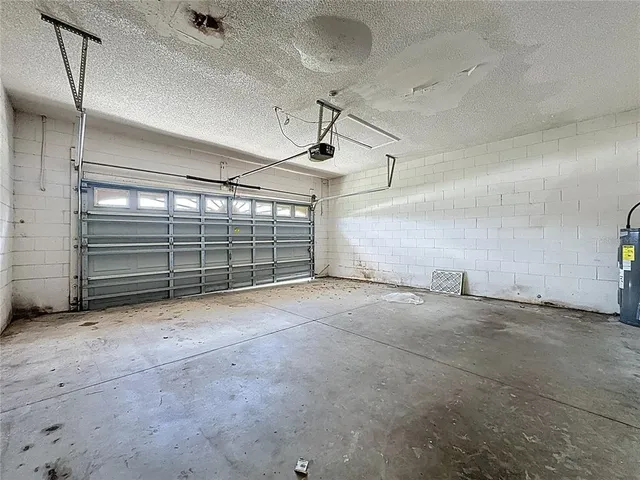 a view of empty room with wooden ceiling