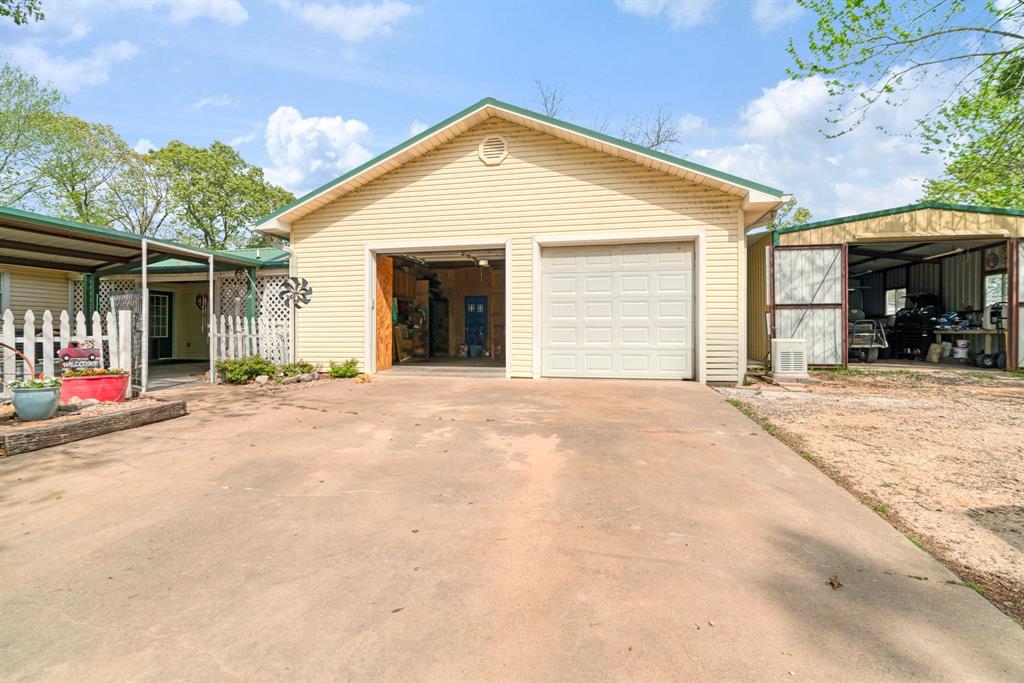 3178 East 2150 Road Grant, OK 74738 - Photo 19 of 40 a view of a house with a yard and garage