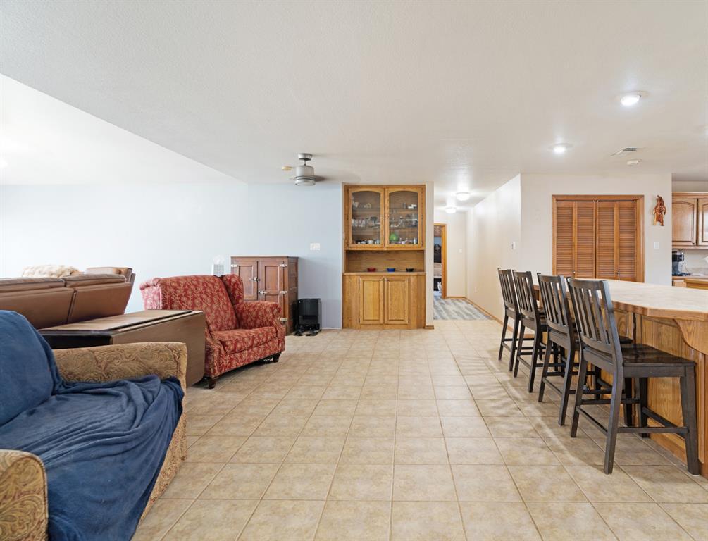 3178 East 2150 Road Grant, OK 74738 - Photo 3 of 40 a living room with furniture and a dining table with kitchen view