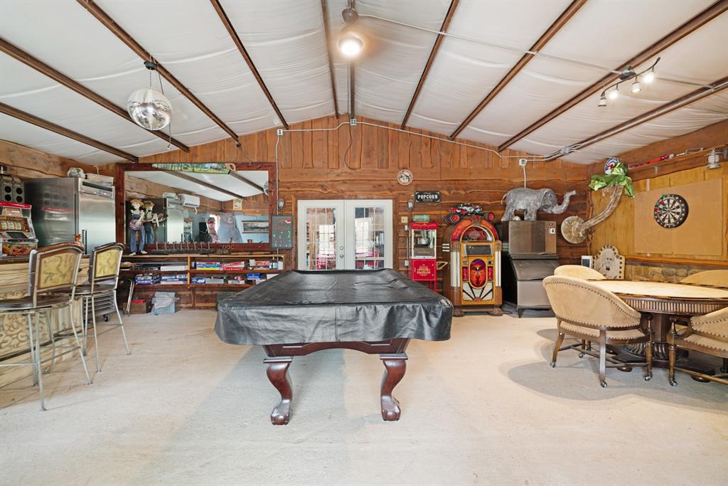 3178 East 2150 Road Grant, OK 74738 - Photo 32 of 40 a room with lots of furniture and a chandelier