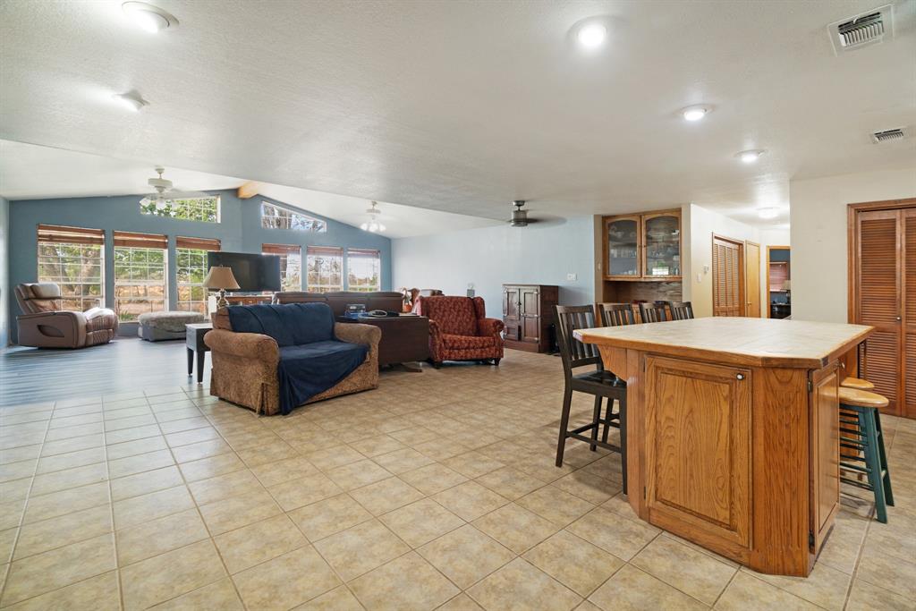 3178 East 2150 Road Grant, OK 74738 - Photo 5 of 40 a large living room with stainless steel appliances furniture a rug and a view of kitchen